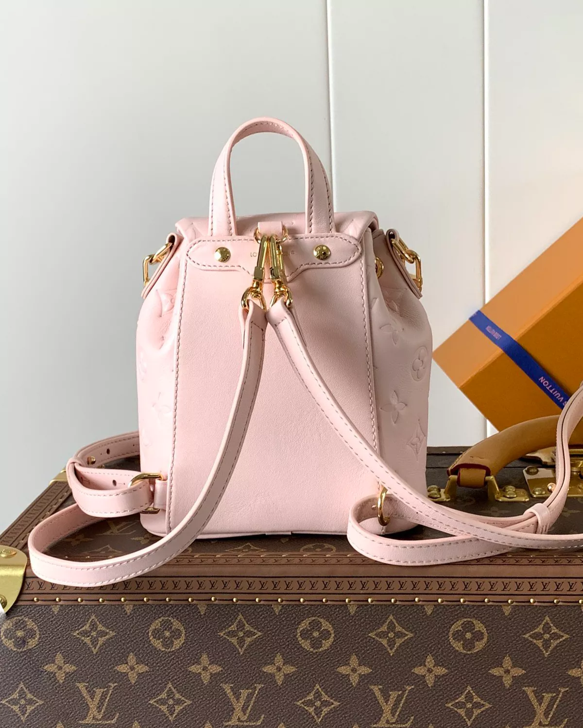Coussin Backpack Mini in Jasmine Pink lambskin leather with Monogram pattern.