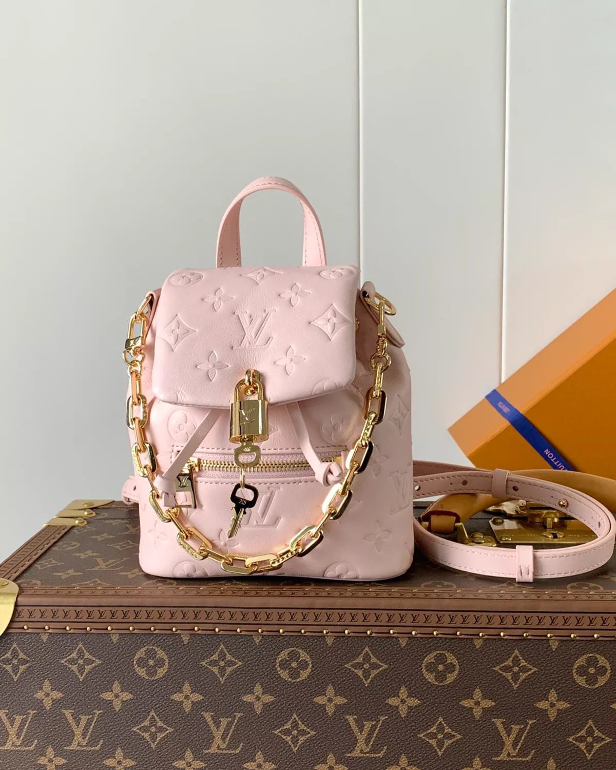 Coussin Backpack Mini in Jasmine Pink lambskin leather with Monogram pattern.