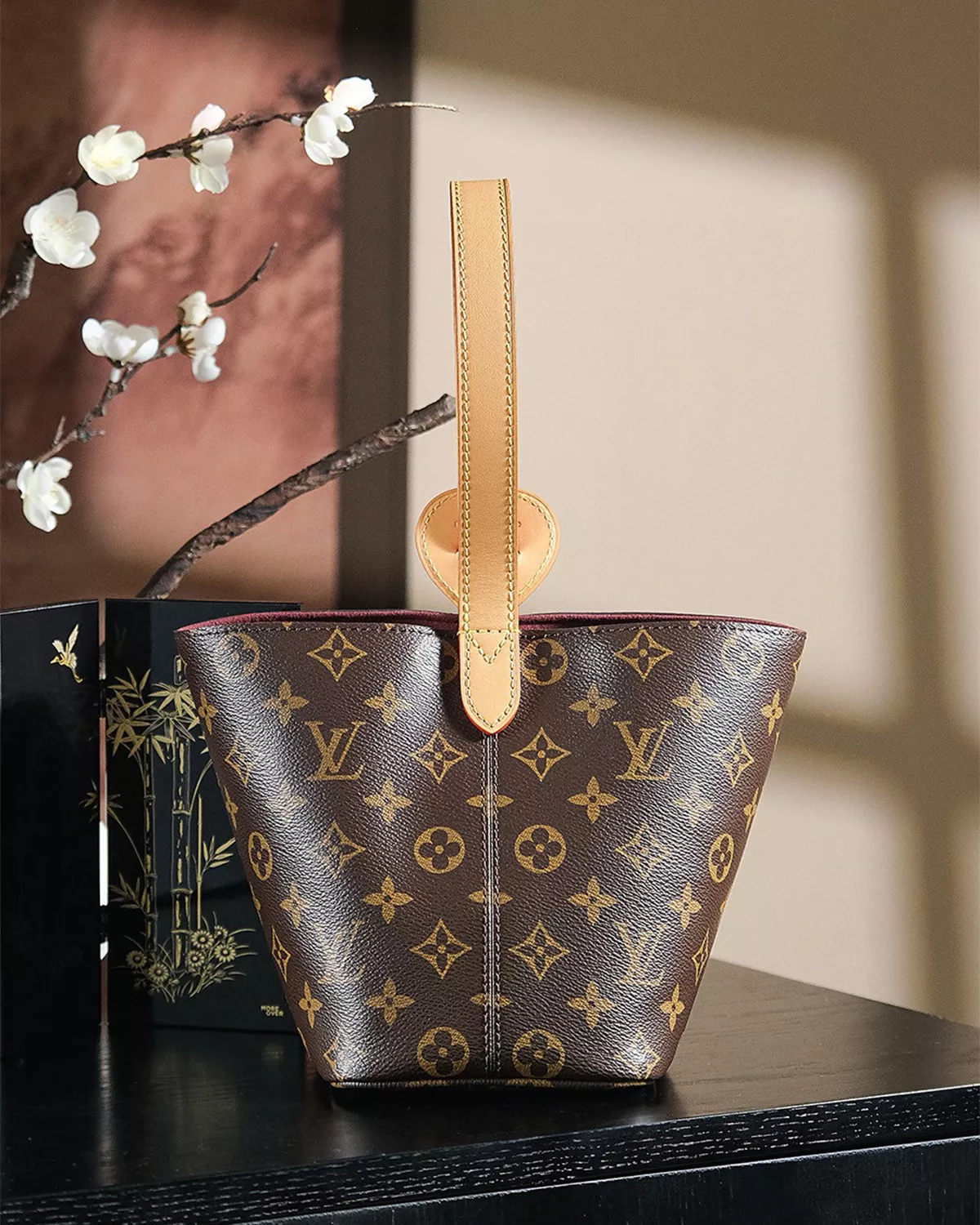 Rebce All In BB monogram canvas crossbody bag with gold hardware and foldable design.