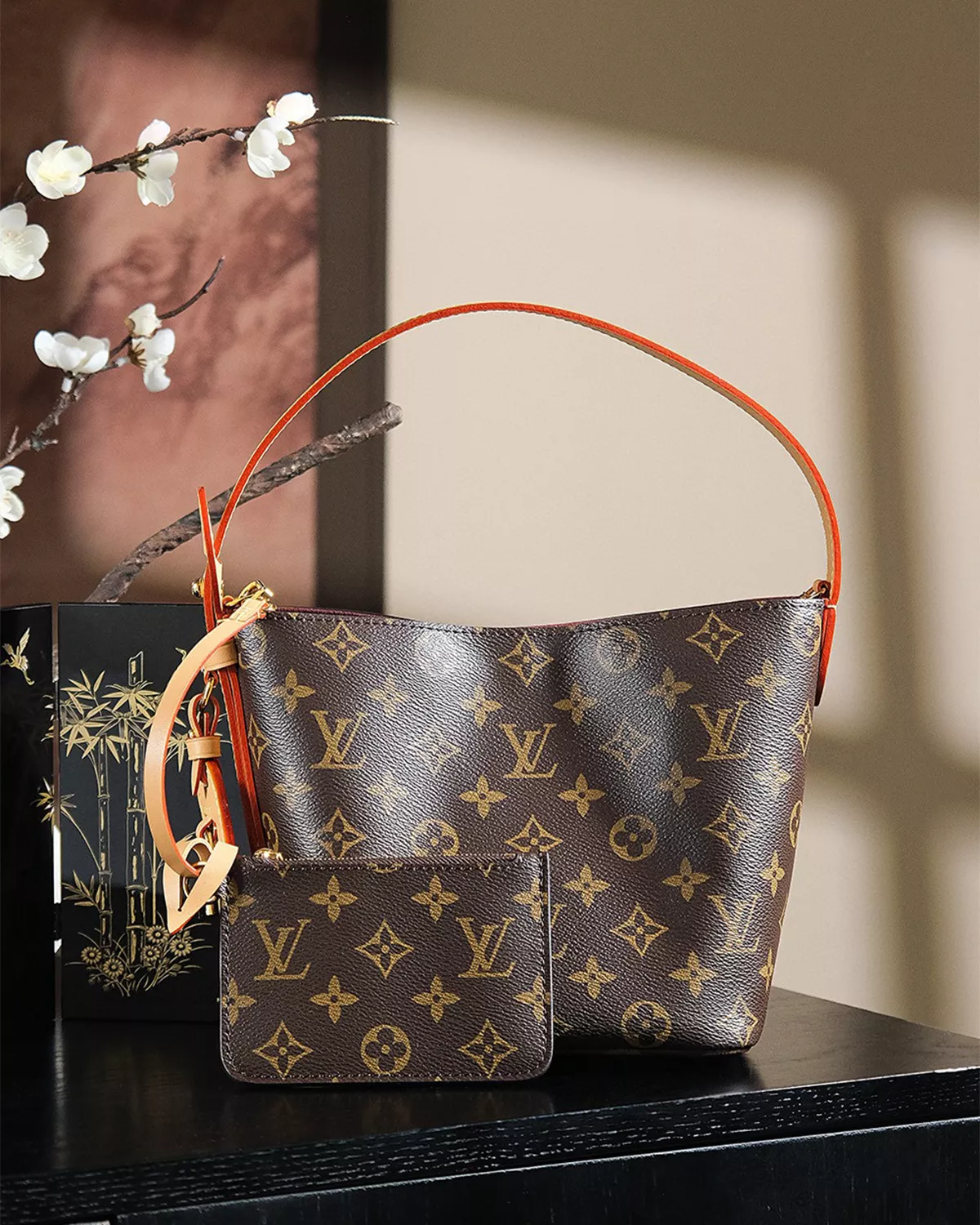 Rebce All In BB monogram canvas crossbody bag with gold hardware and foldable design.