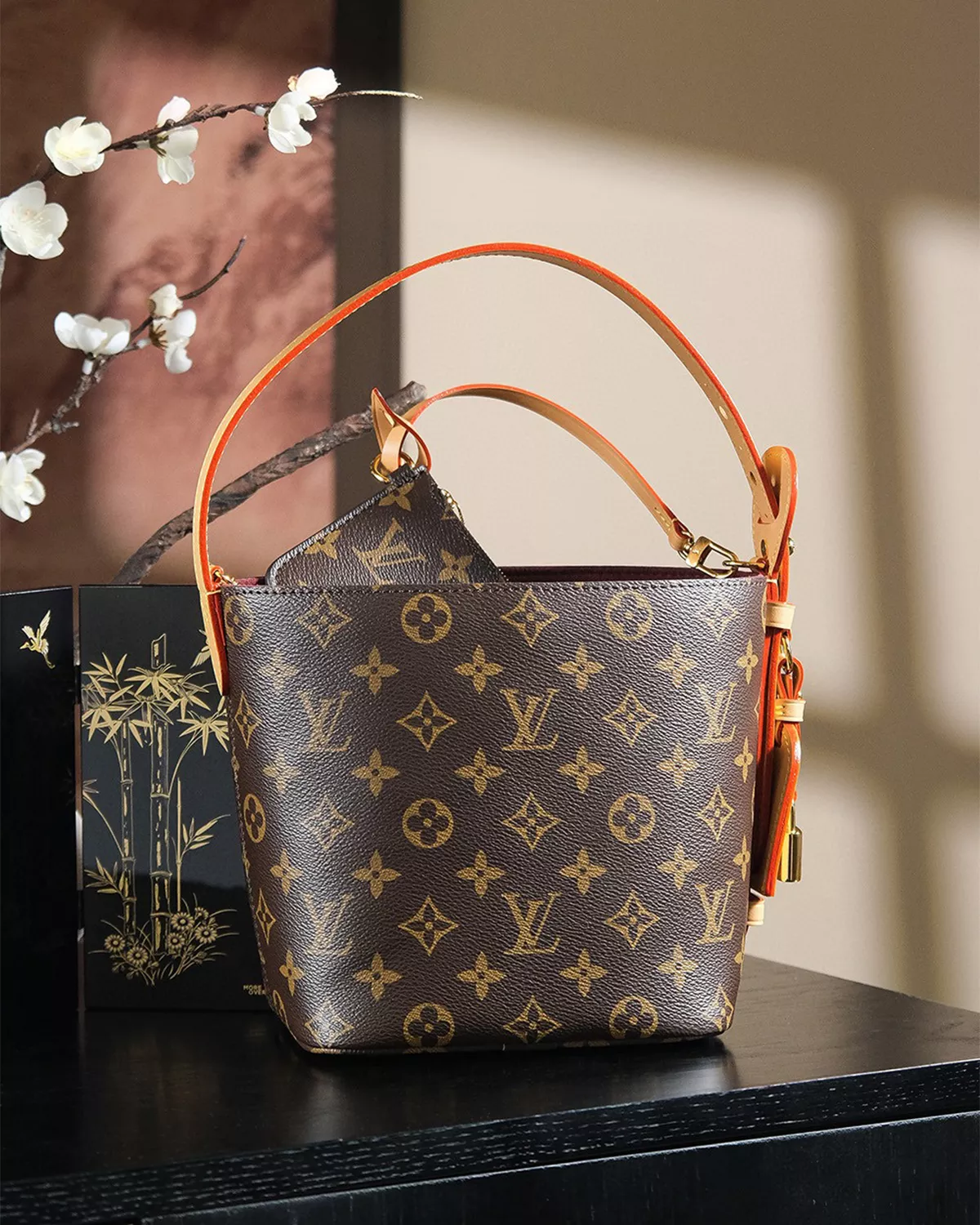 Rebce All In BB monogram canvas crossbody bag with gold hardware and foldable design.