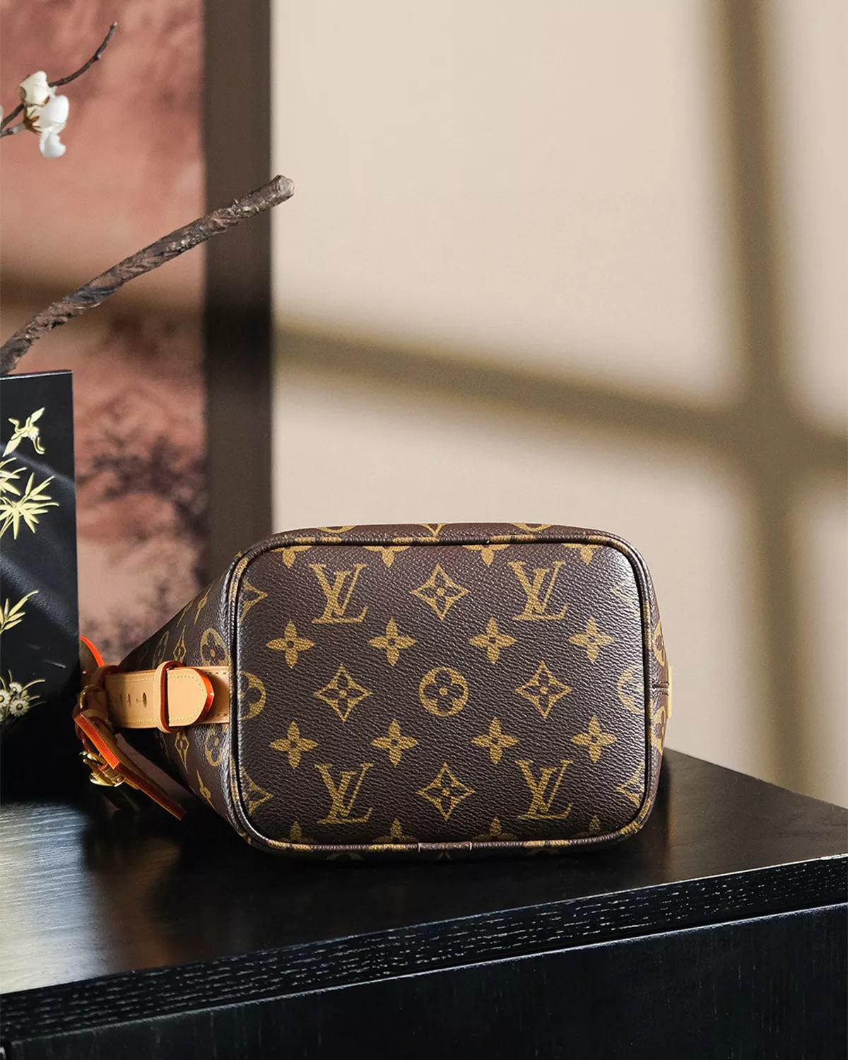 Rebce All In BB monogram canvas crossbody bag with gold hardware and foldable design.