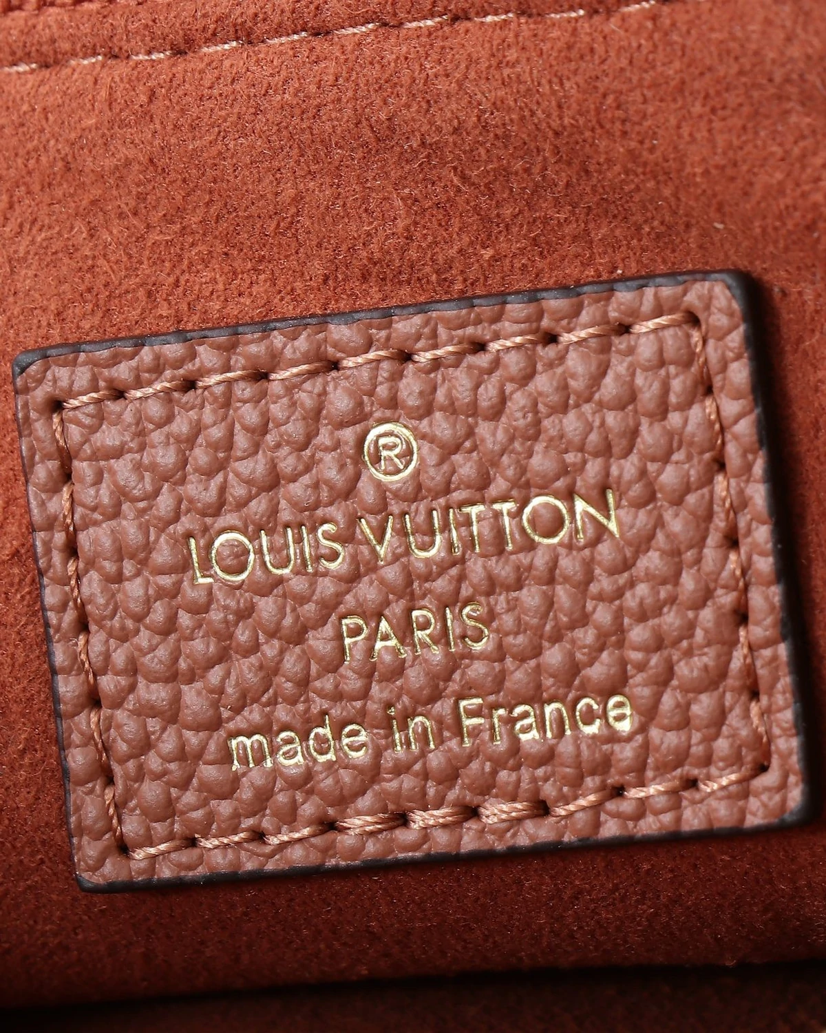 Liv Pochette “Monogram Empreinte Leather Cognac ”