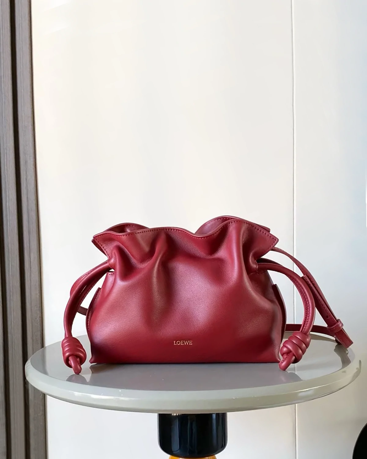 Mini Flamenco clutch in nappa calfskin “Burnt Red”