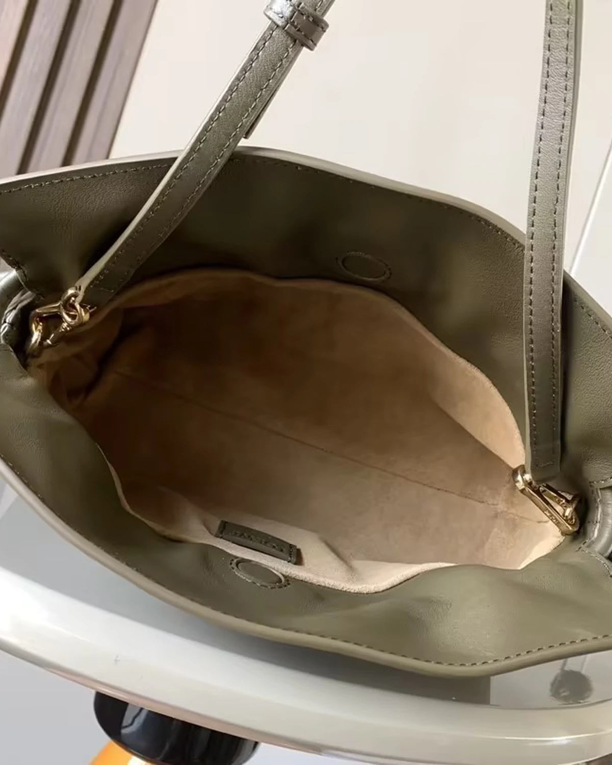 Mini Flamenco clutch in nappa calfskin “Dark Khaki”