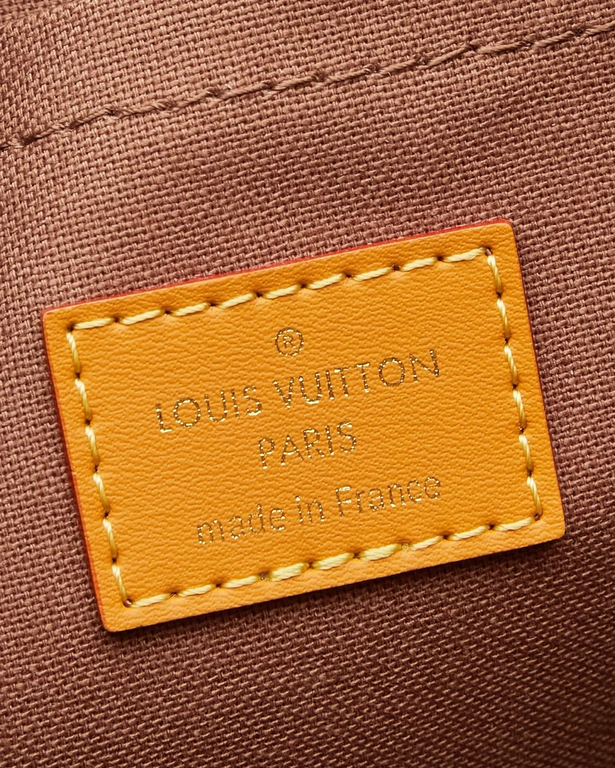 nil-monogram-archive (5) Part of the Monogram Archive collection, the Nil is an on-trend small bag made from Monogram coated canvas with natural cowhide-leather trim. Blending vintage details with modern elegance, it features reenforced corners and the pearl zip-pulls recently introduced by Pharrell Williams. A removable handle and a detachable strap give carry options.