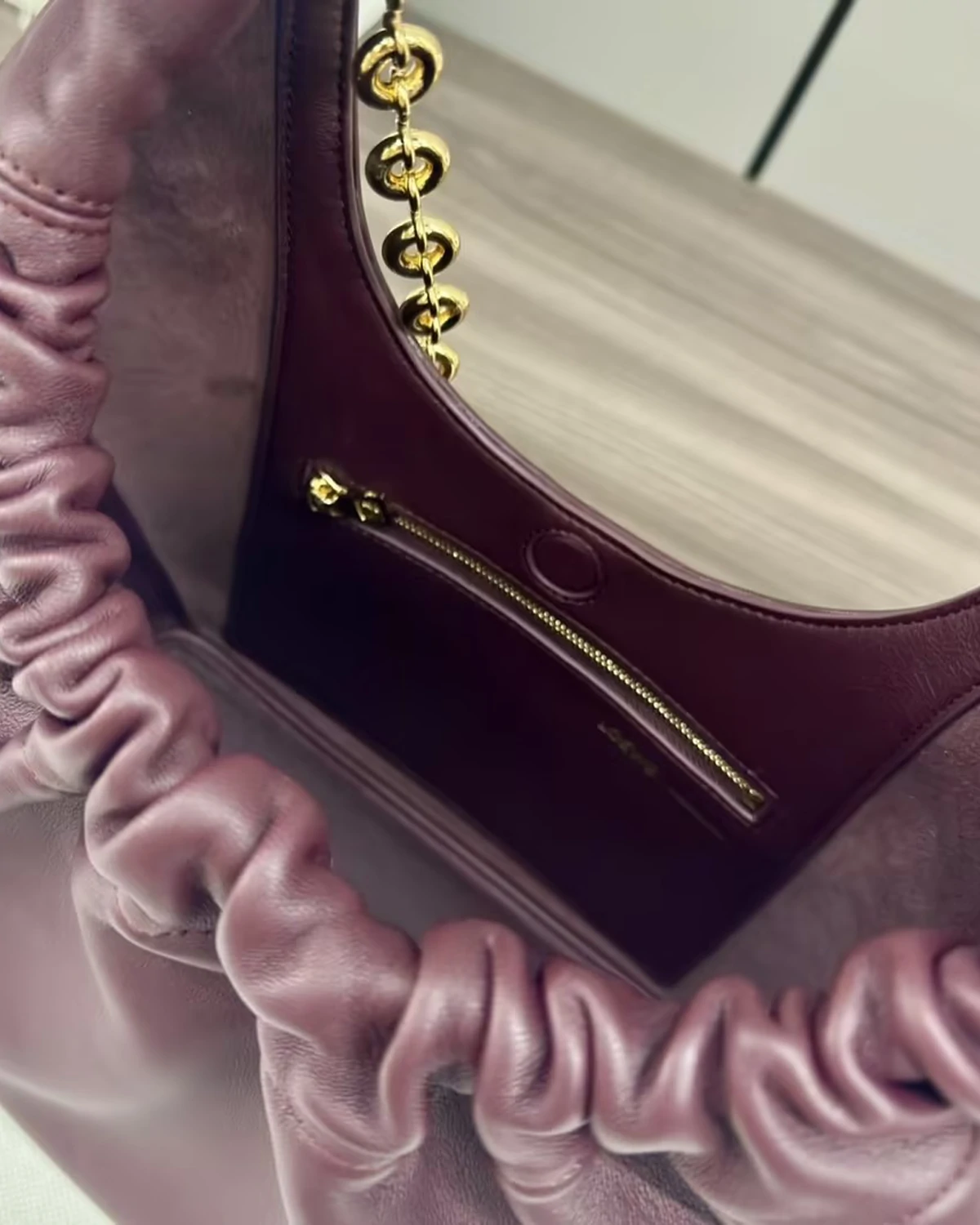 Small Squeeze bag in mellow nappa lambskin “Dark Burgundy”