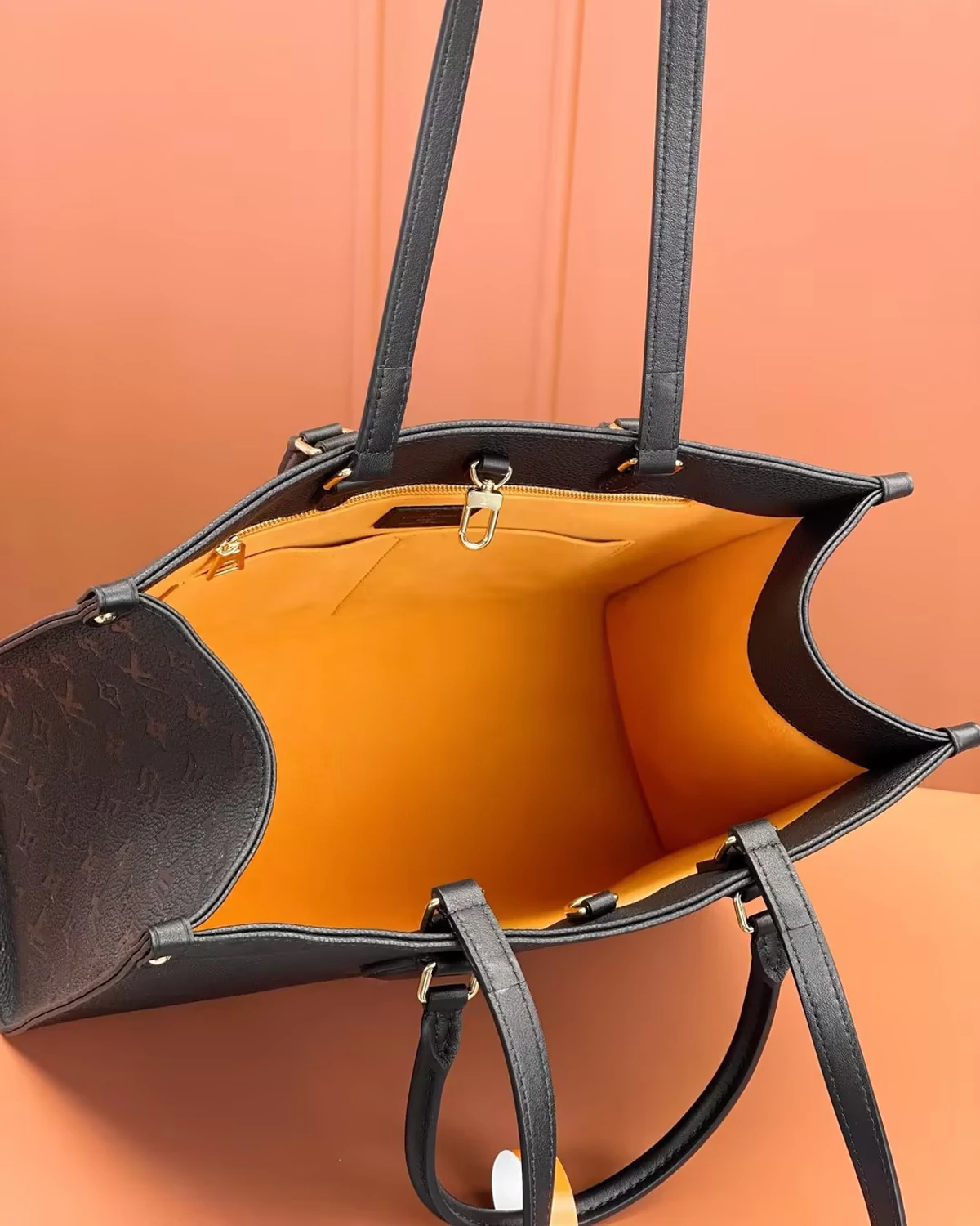 OnTheGo MM “Monogram Empreinte Leather Black”